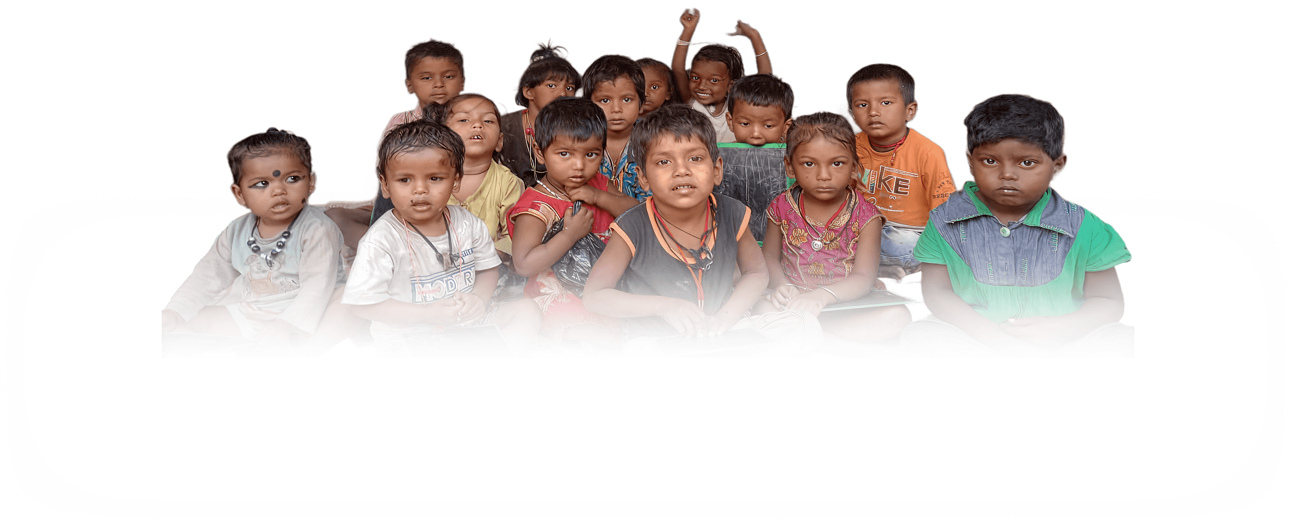 Group of underprivileged children sitting together in a classroom, representing Pararthya SDECS education outreach program